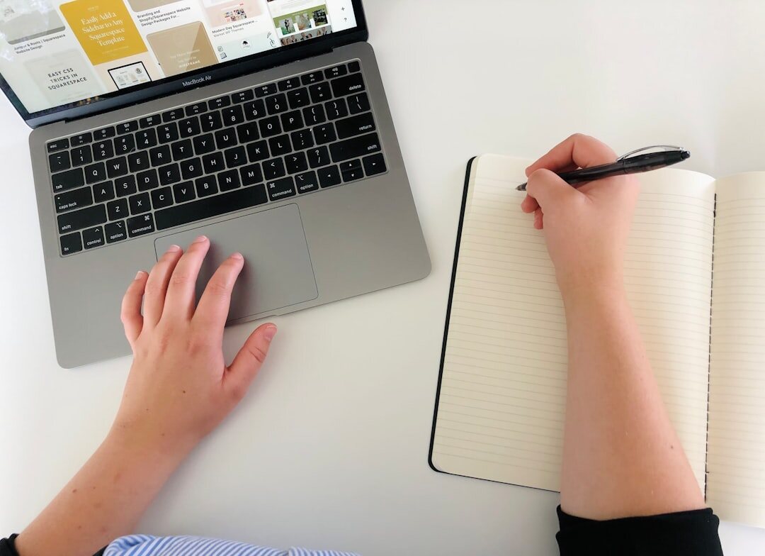 writer at desk with notebook