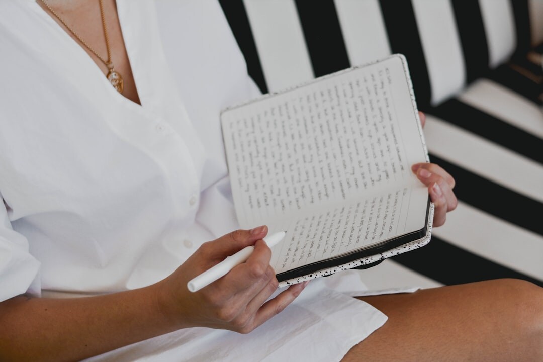 author writing in journal