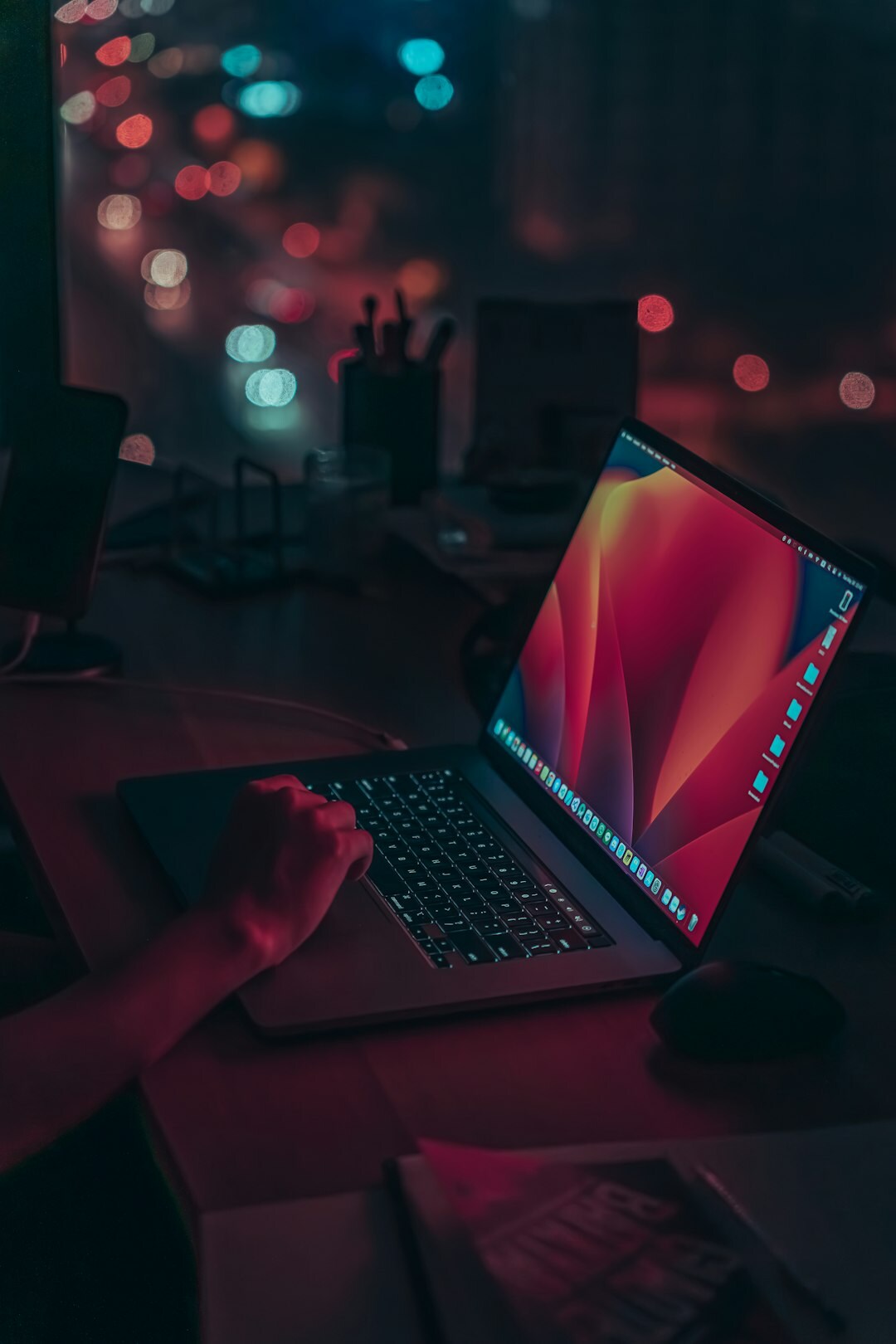 mystery writer at laptop in evening light